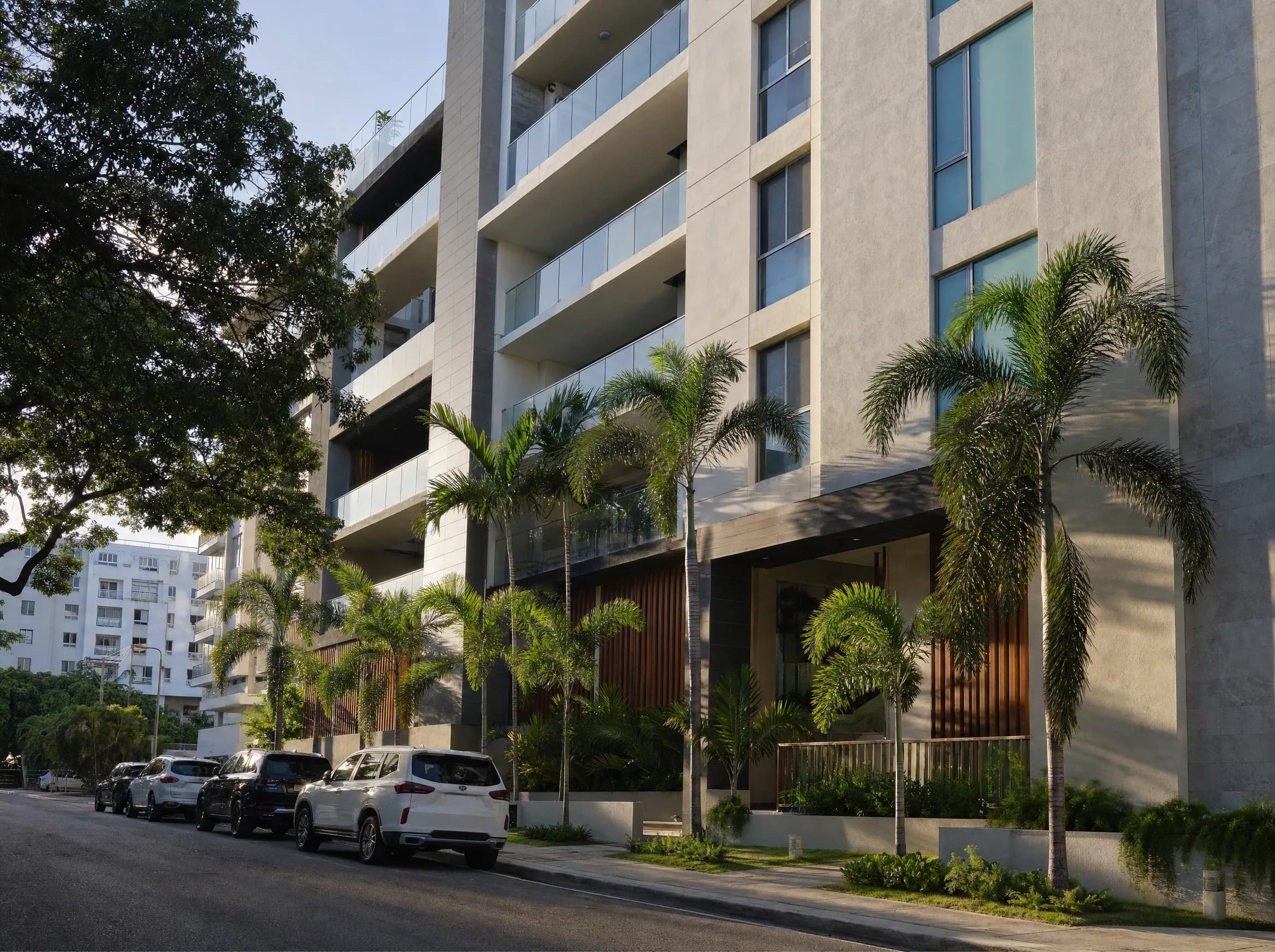 Facade of a modern residential building in the Serralles sector of Santo Domingo with contemporary architecture and palm trees
